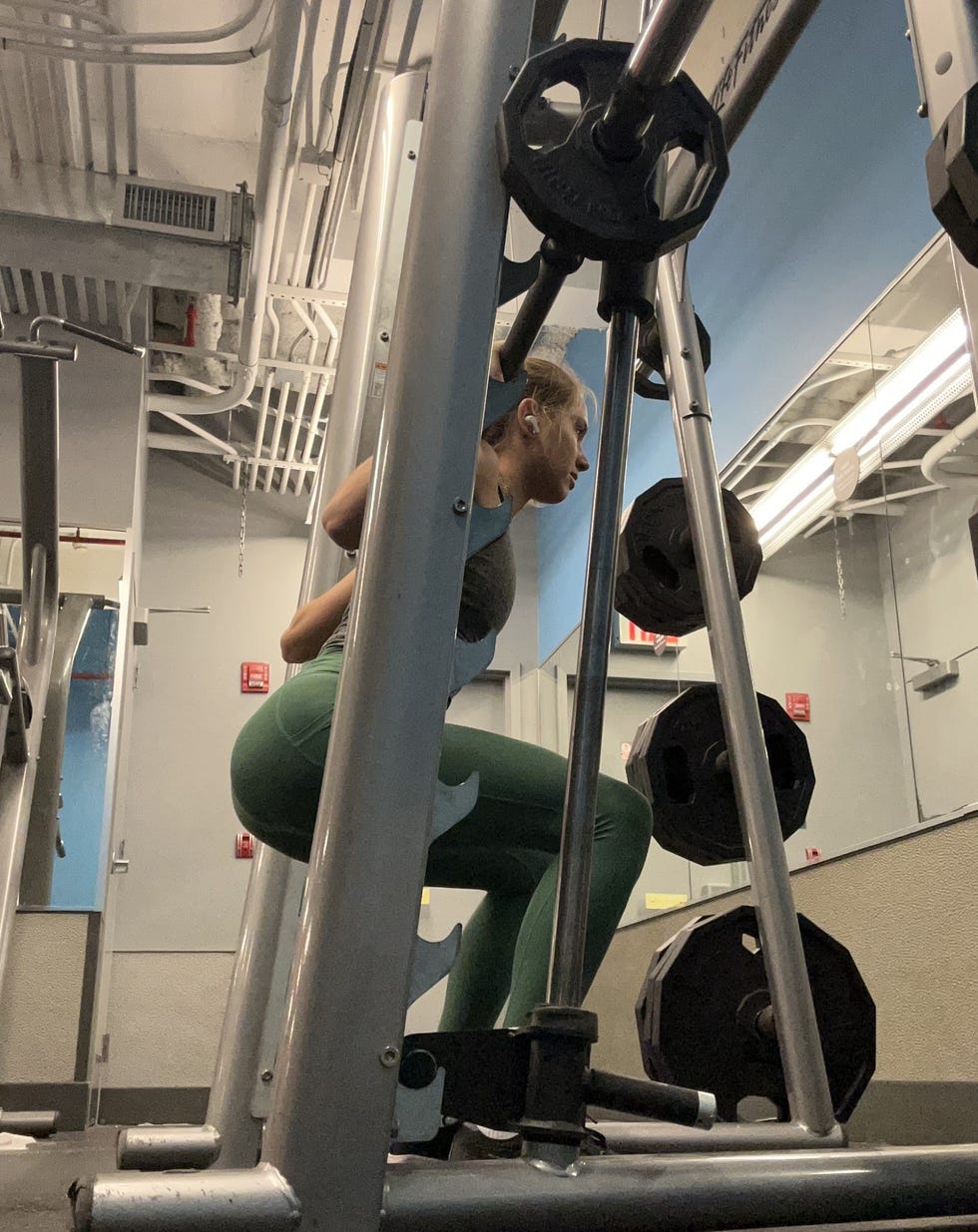 the writer doing a back squat on the smith machine