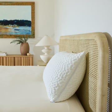 bedroom scene featuring a bed decorative elements and an artwork bedroom scene featuring a bed decorative elements and an artwork