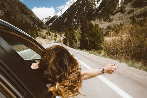 young woman on road trip