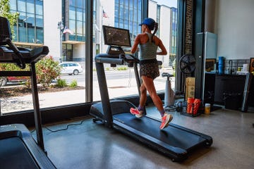 a person running on a aviron victory treadmill