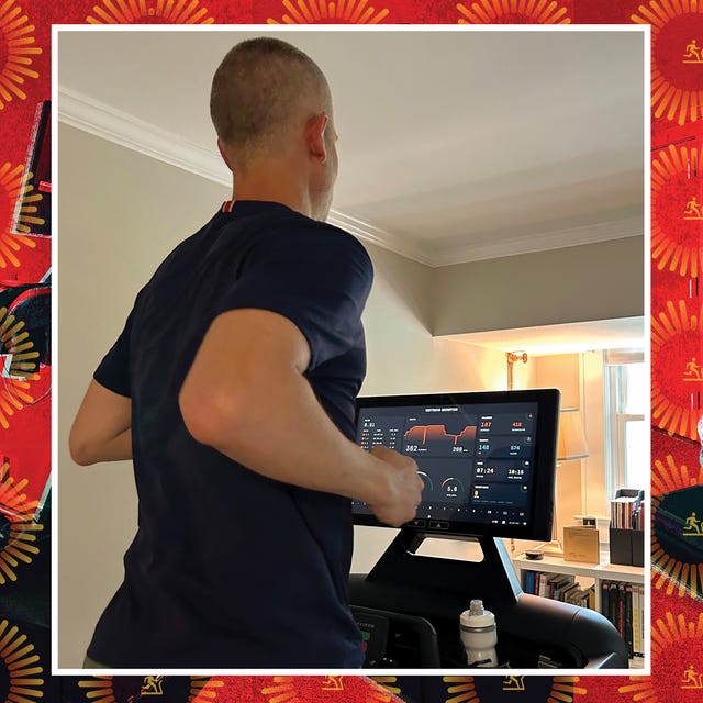 looking over a mans shoulder to see treadmill display