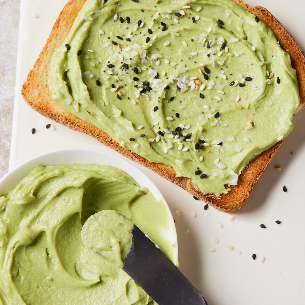 whipped green avocado butter in a yellow ramekin