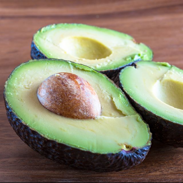 Healthy Eating: Avocado fruit cut in half displaying the seed