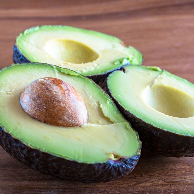 Healthy Eating: Avocado fruit cut in half displaying the seed