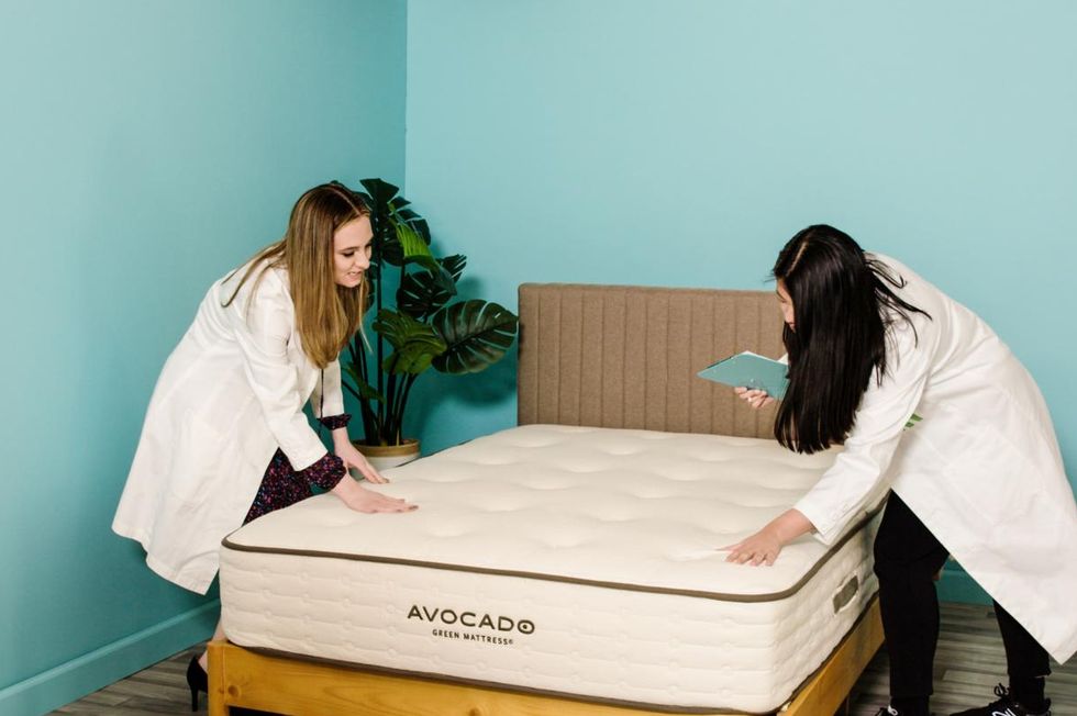two analysts observing the construction of a mattress