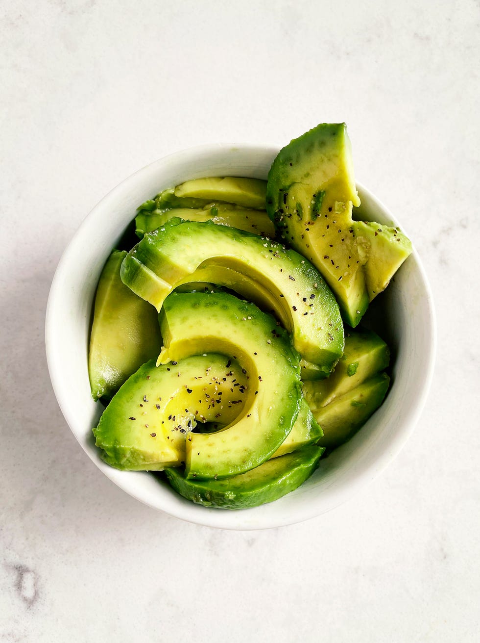 slices of fresh avocado in a bowl