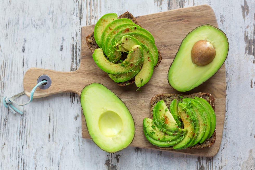 avocados on a wooden cutting board