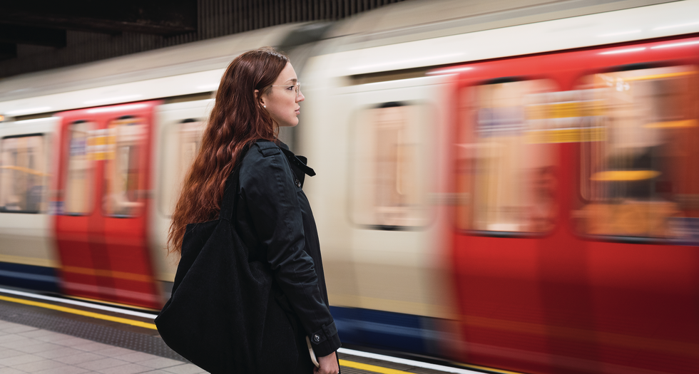 woman waits for london underground train
