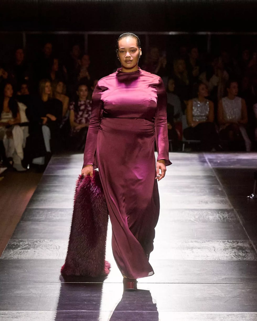 model showcasing a stylish evening dress on a runway