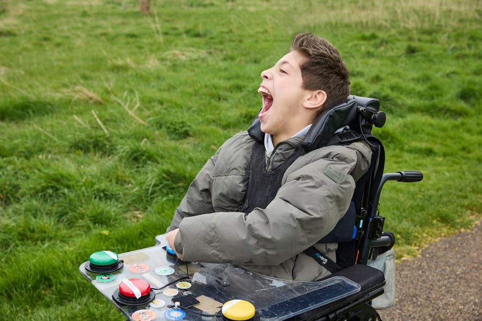 george beard sitting in a wheelchair