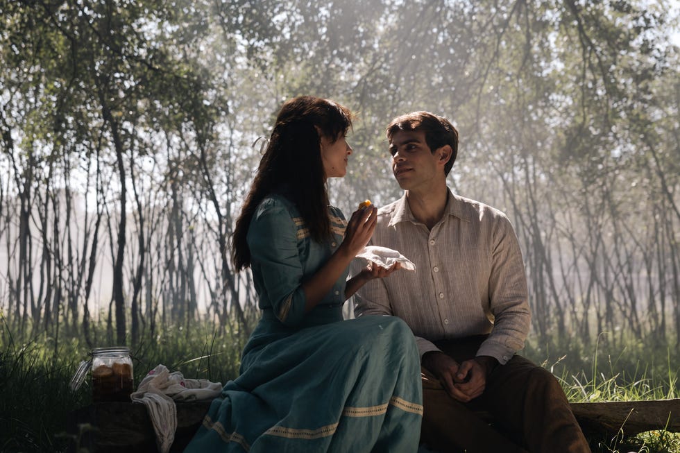 a couple enjoying a moment together outdoors in a natural setting