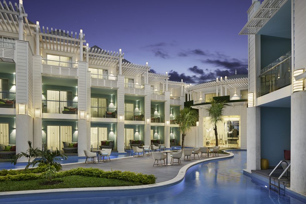 a partial view of azul beach resort which features the rooms, smaller pool areas and room balconies