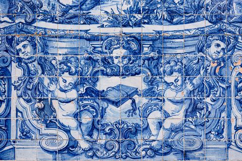 azulejos tiles on the facade of capela das almas, an 18th century chapel in porto, portugal