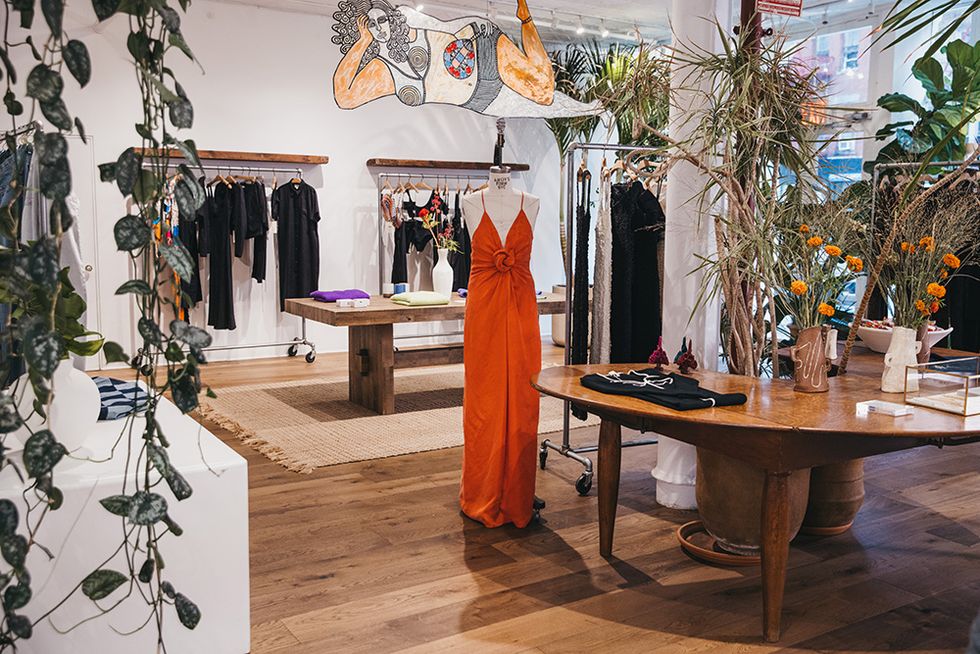 the mara hoffman store including racks of clothing and the dress designed with cirq on a mannequin