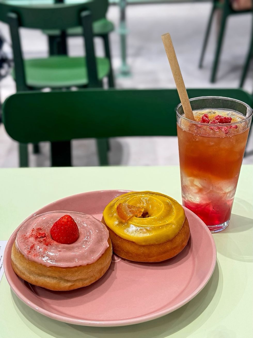 a plate of donuts and a drink on a table