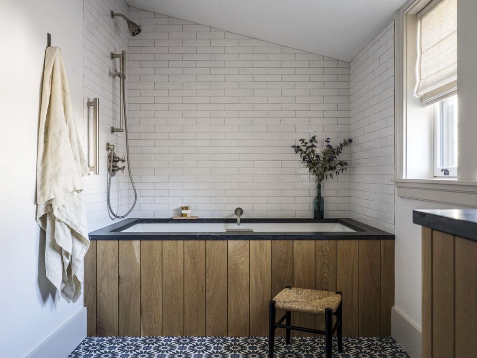 bathtub, blue and white tiles