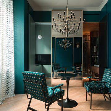 Modern dining area featuring a round table and patterned chairs modern dining area featuring a round table and patterned chairs