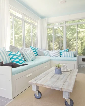sunroom ideas with two white wooden couches