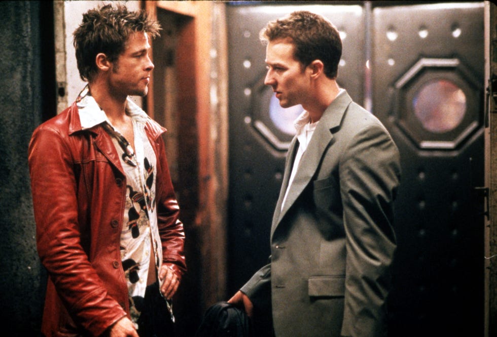 a fight club movie still showing two men looking at each other