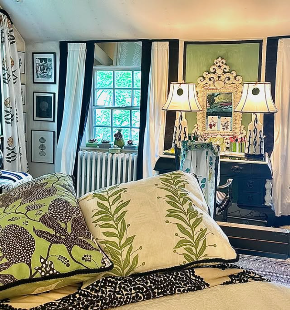Cozy bedroom with decorative pillows and a vibrant decor theme.