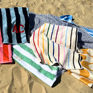 beach towels a variety of beach towels lying on sand