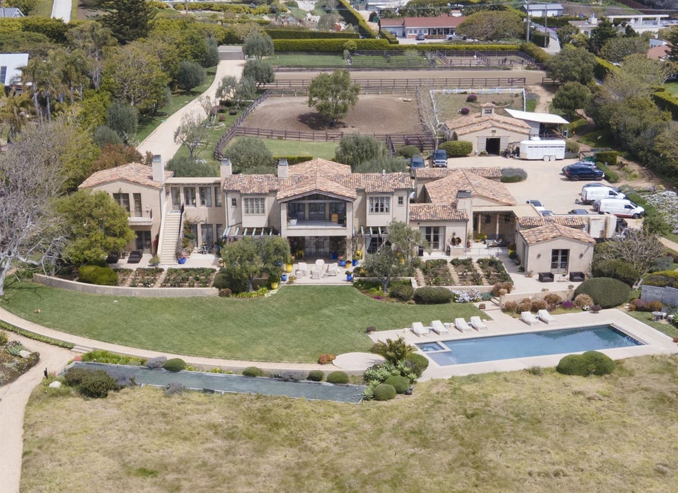 Luxurious residence with a swimming pool, garden, and horse stable.