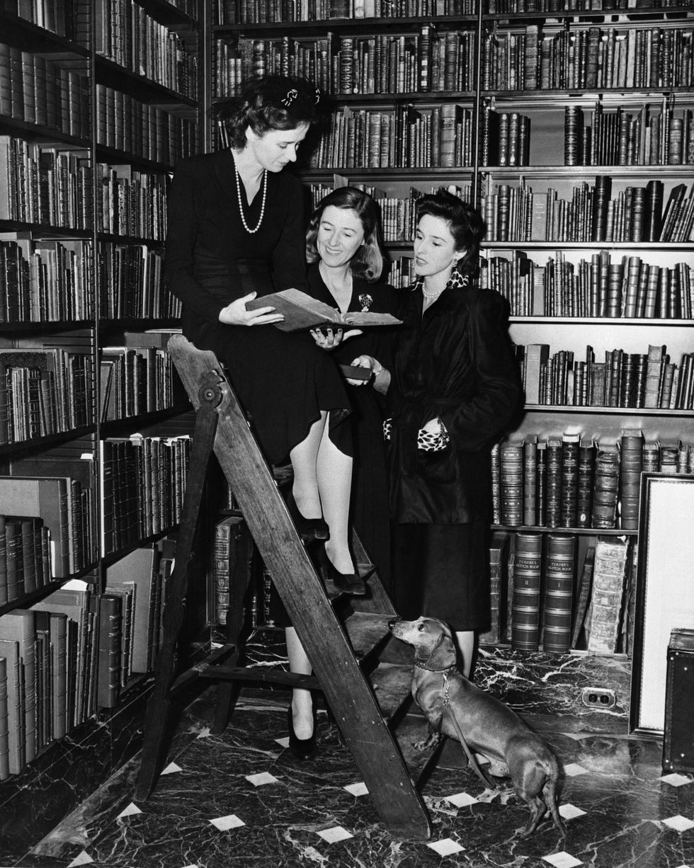 betsy cushing, mary cushing, and barbara cushing, selecting books in dr asw rosenbach's famous library, to be auctioned off for benefit of american red cross war relief fund