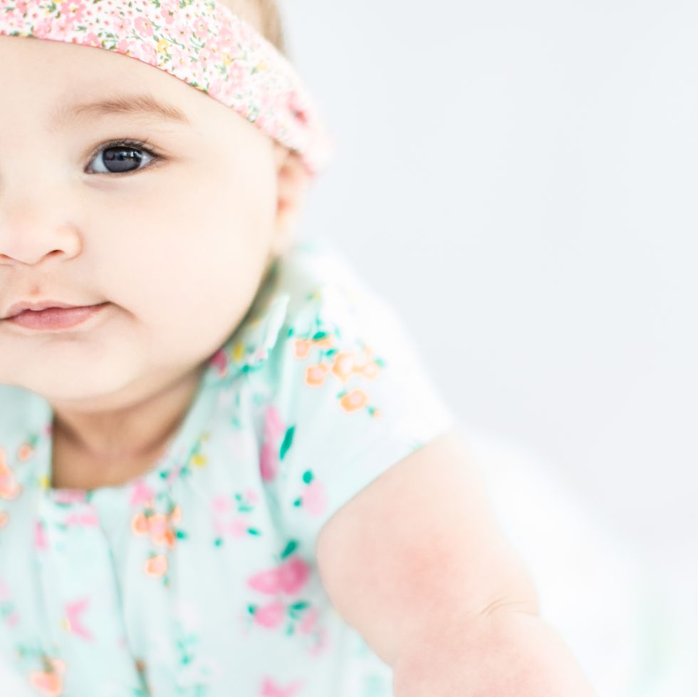 multicultural baby names baby girl crawling, development stage