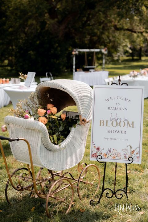 baby in bloom baby shower theme pram filled with flowers