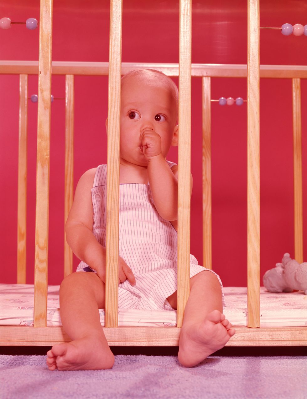 baby in playpen, sucking thumb photo by h armstrong robertsretrofilegetty images