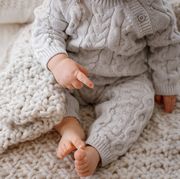 baby legs in gray cable knit romper
