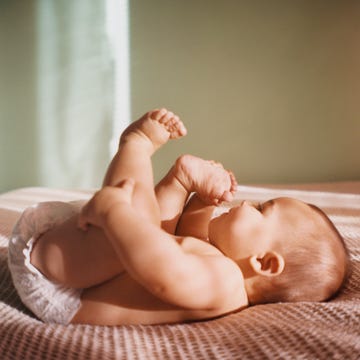 Cute baby names baby laying on bed cute baby names baby laying on bed