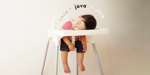 sleeping baby in a high chair