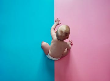 baby on blue and pink background