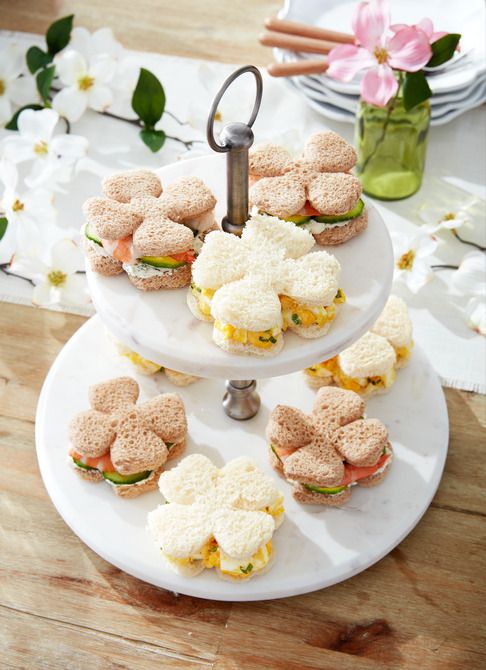 flower shaped tea sandwiches on a two tiered plate server