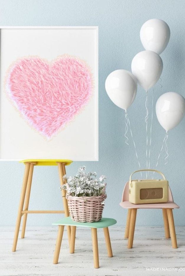 a fur heart on a display easel with other party decorations