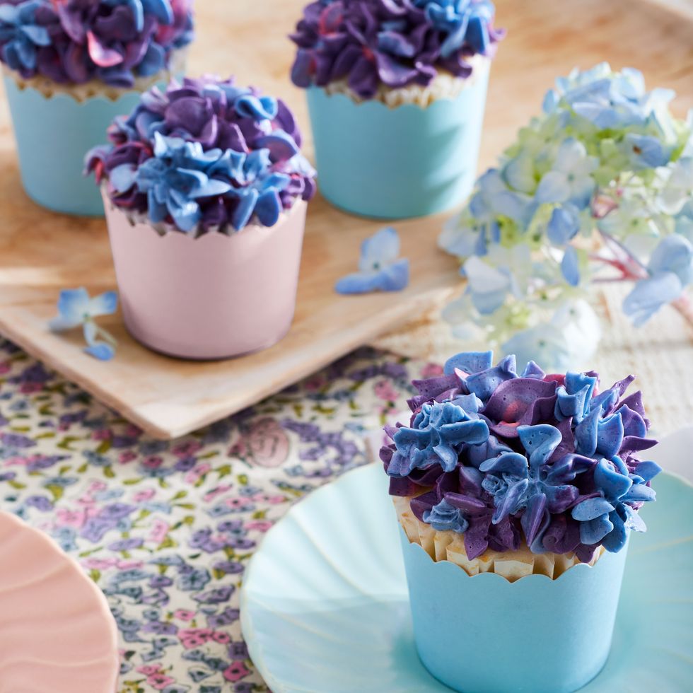 cupcakes with blue and purple frosting made to look like hydrangeas