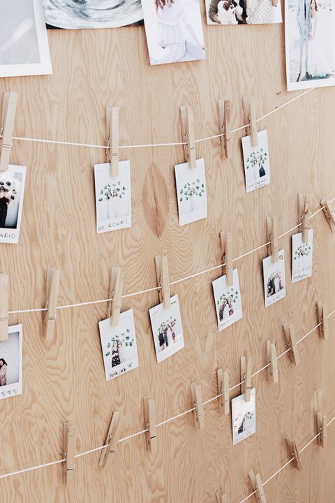 strining up instamax polaroids at the shwer on clotheslines with clothespins is a great baby shower idea