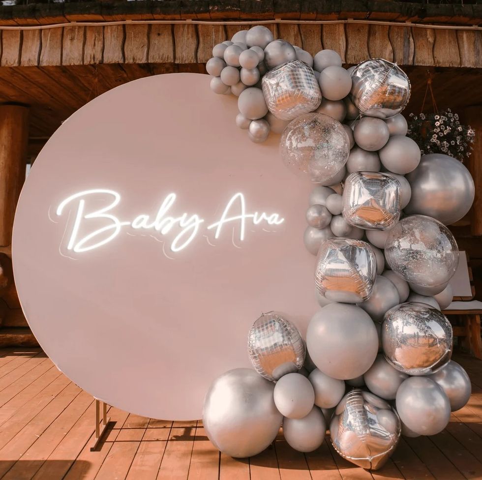a "baby ava" neon sign, a great baby shower idea