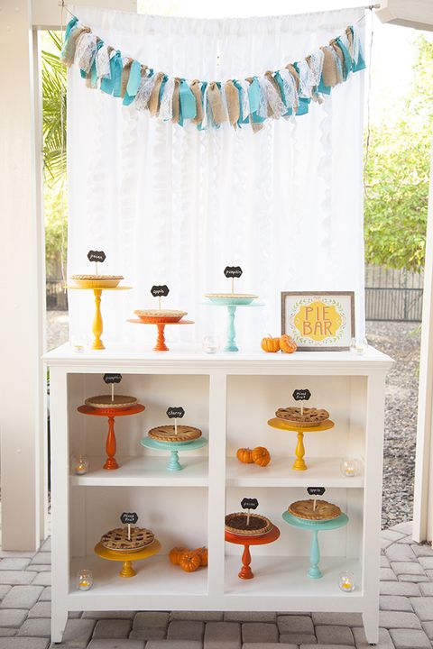 a pie bar, with different pies on different colored stands, is a great baby shower idea