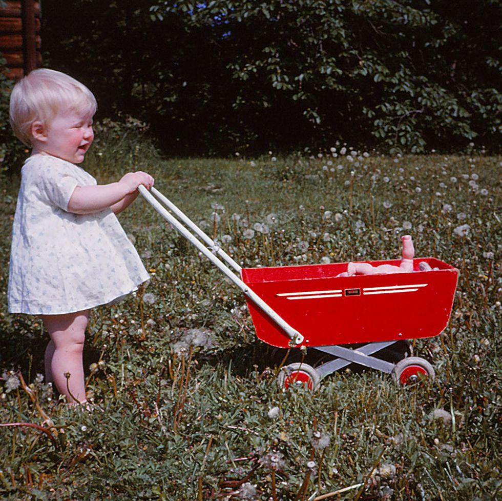 baby with red pram