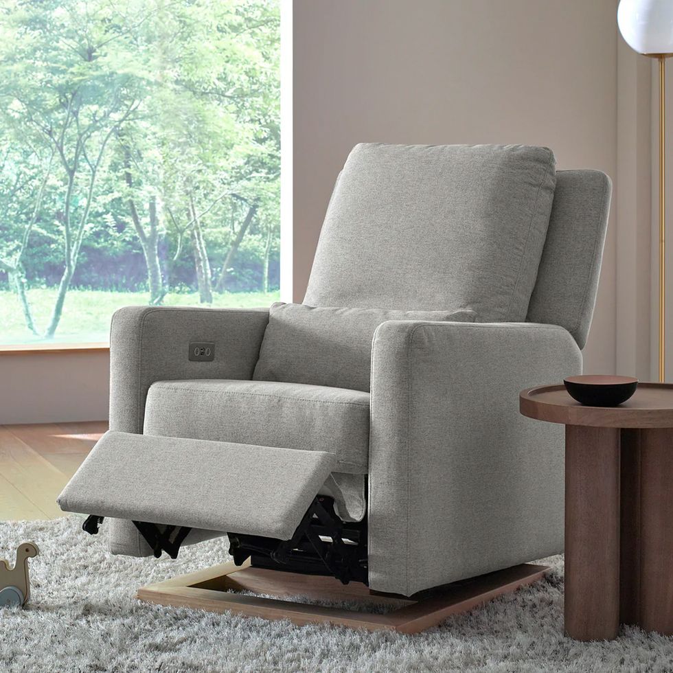 sigi glider in a reclined position inside of a bright living room