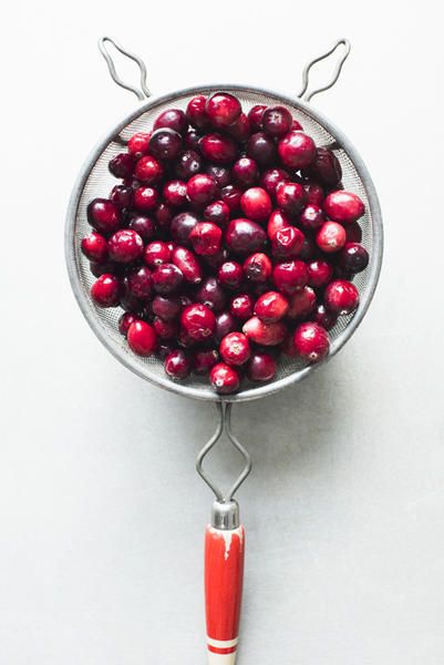 Red, Cranberry, Berry, Fruit, Plant, Food, Cherry, Fashion accessory, Glass, Stemware, 