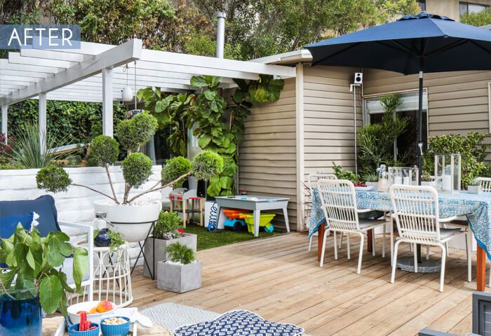 playful pergola in backyard next to a deck with dining and lounging furniture