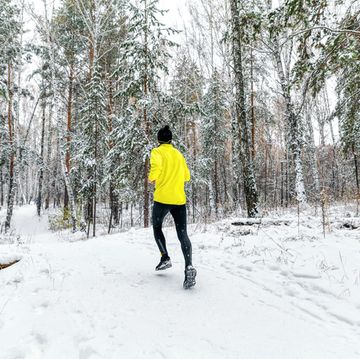 back male runner run winter forest trail race