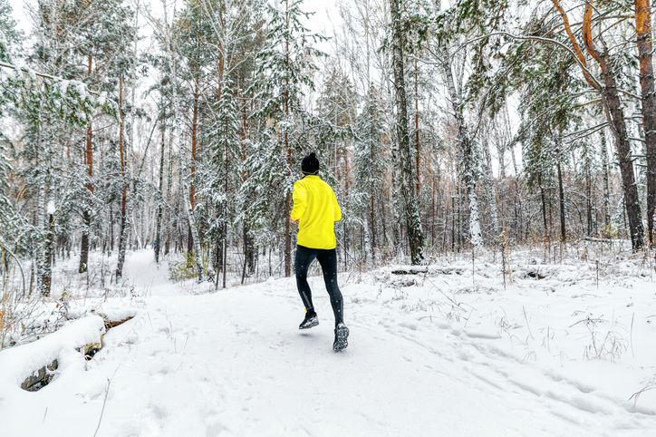 back male runner run winter forest trail race
