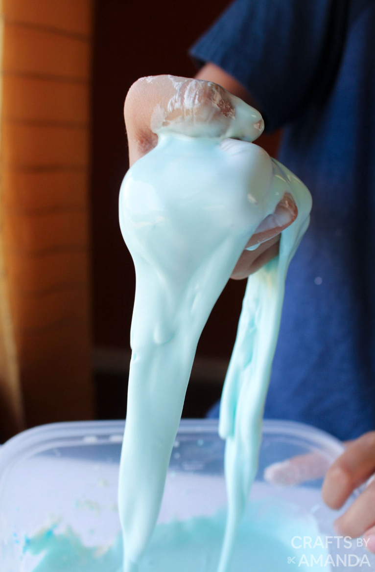back to school activities, hand holding blue slime