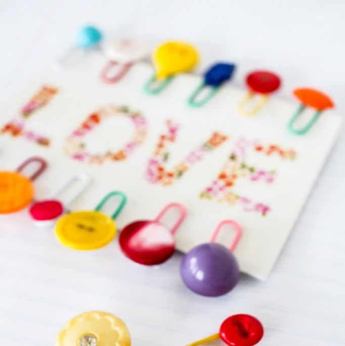 button bookmarks on a card that says love