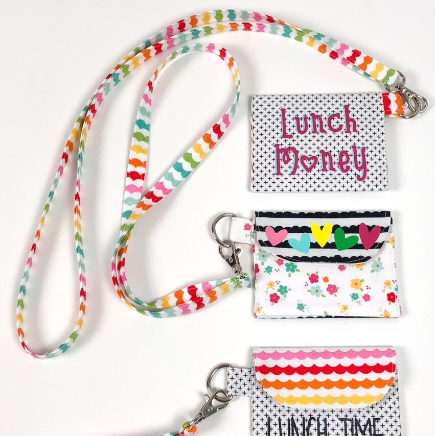 three lunch money pouches with lanyards