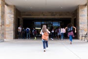 group of school children walking in to school